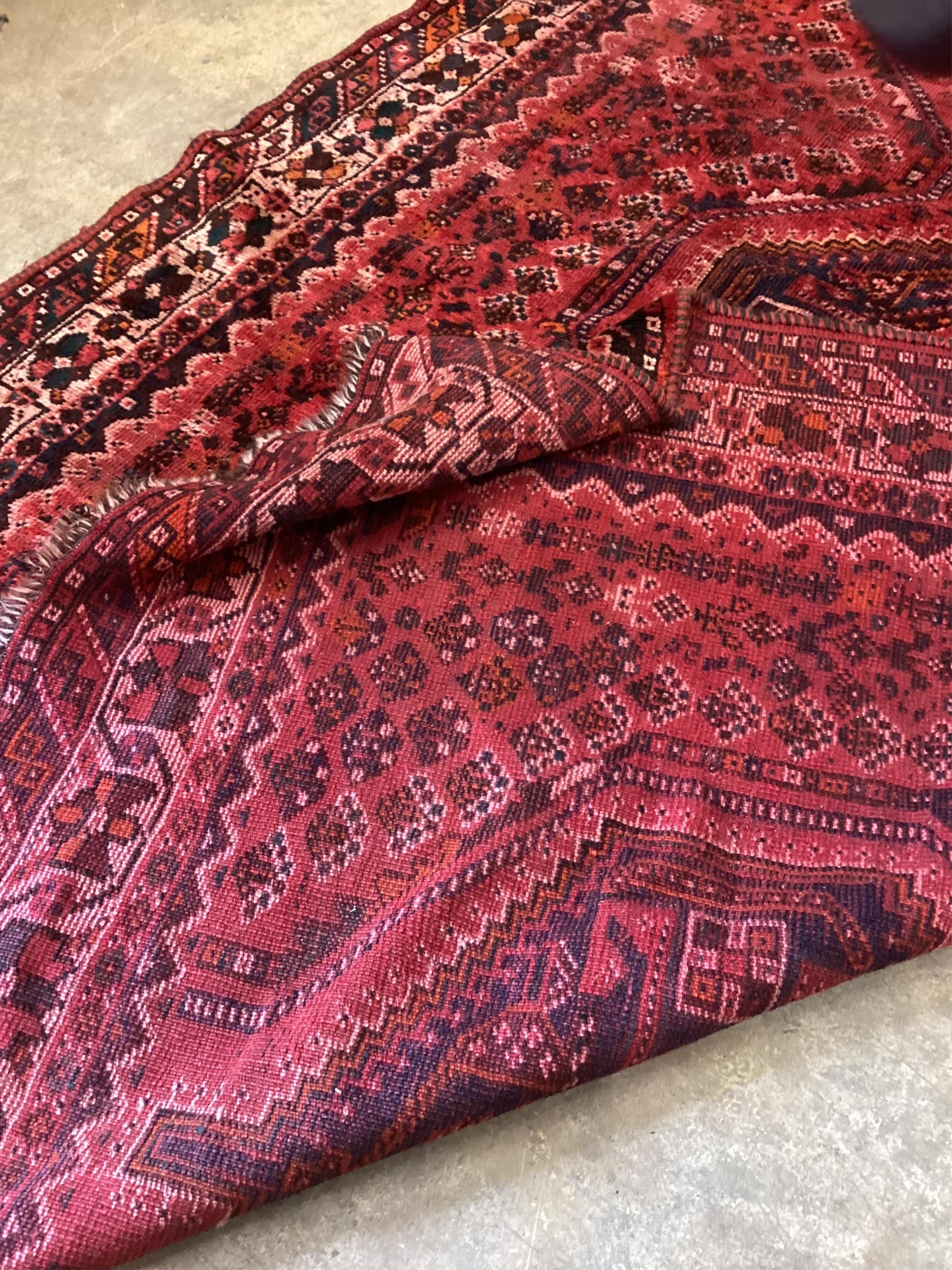 A North West Persian red ground carpet, 294 x 205cm. Condition - fair